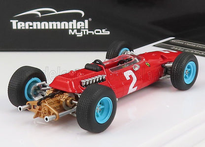 Modèle réduit vintage d'une Ferrari de course rouge avec des roues bleues et le numéro 2, présenté par Tecnomodel, disponible sur Vroomi.