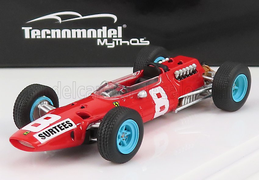 Modèle réduit de voiture de course vintage Tecnomodel rouge Tecnomodel avec roues bleues et Surtees , disponible sur Vroomi.