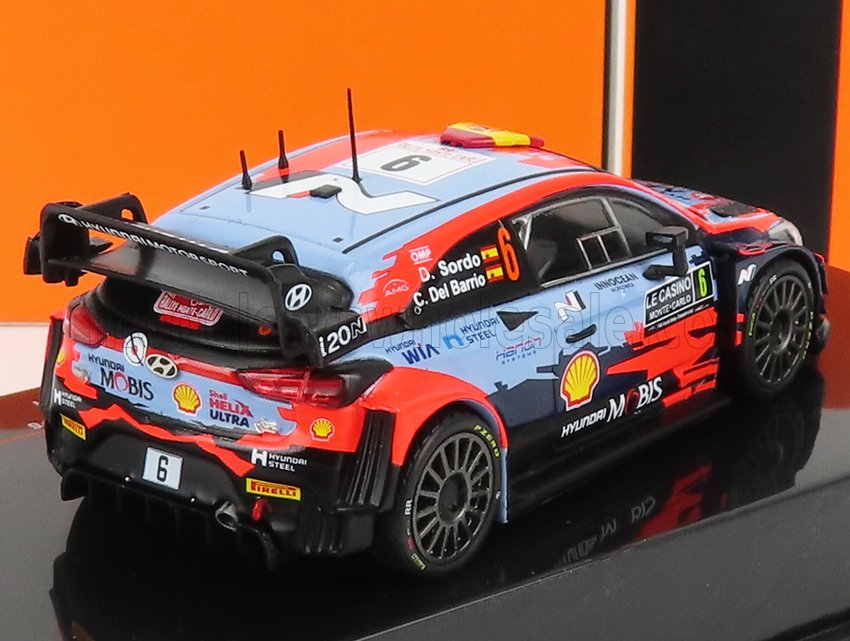 Modèle réduit de voiture de rallye Hyundai N WRC avec livrée rouge et bleue, sponsors détaillés, disponible sur Vroomi