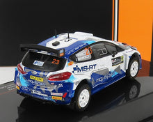 Modèle réduit à l'échelle 1/18 d'une voiture de rallye Ford bleue et blanche avec décalcomanies détaillées, disponible chez Vroomi.