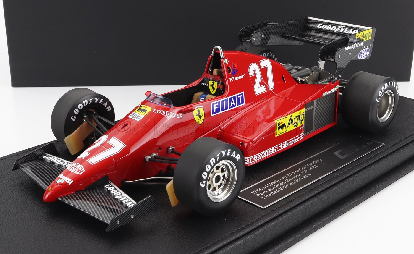 Modèle réduit de Ferrari 126C3 Formule 1 rouge avec le numéro 27 et les logos des sponsors, présenté sur un socle noir, désormais disponible sur Vroomi.