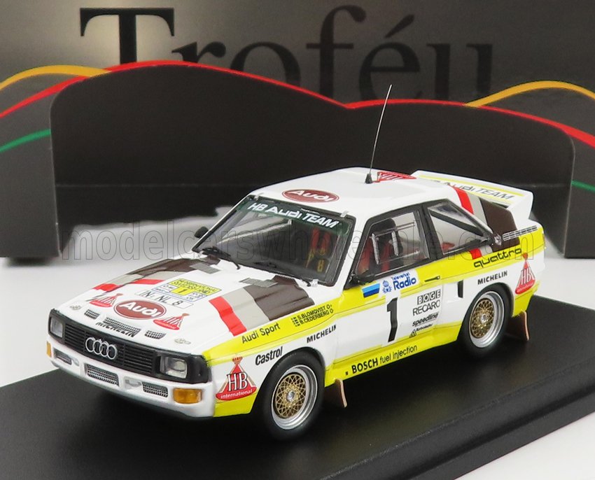 Modèle réduit de voiture de rallye Audi Quattro aux couleurs de l'équipe HB Audi Team, disponible sur Vroomi.