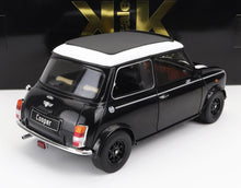 Modèle réduit de Mini Cooper classique noire avec toit blanc et intérieur détaillé, disponible sur Vroomi.