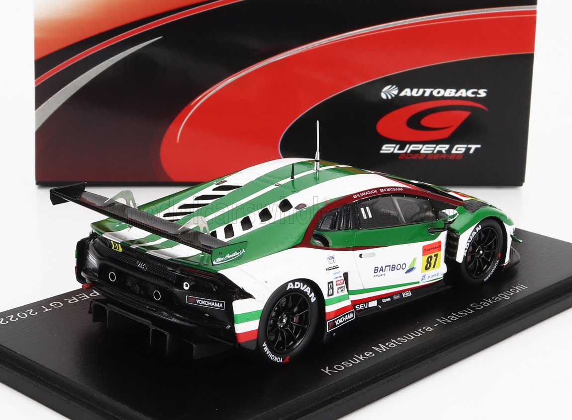 Modèle réduit à l'échelle 1:43 d'une voiture de course Super GT verte et blanche portant le numéro 87, disponible à l'achat via Vroomi.