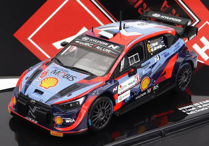 Modèle réduit de voiture de rallye Hyundai WRC à l'échelle 1/18 avec logos des sponsors, disponible chez Vroomi