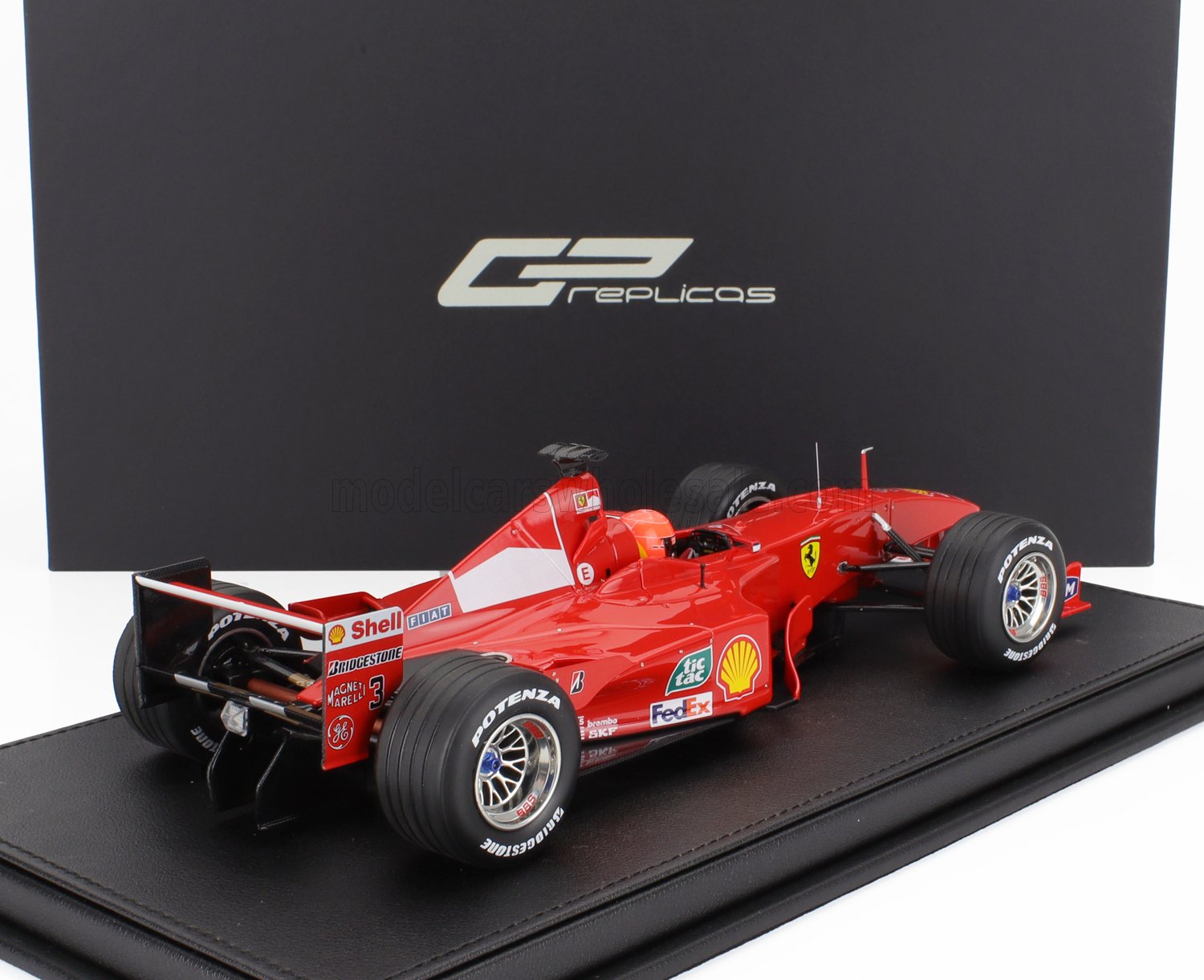 Modèle réduit de Ferrari Formula 1 rouge avec logos des sponsors, disponible chez Vroomi.