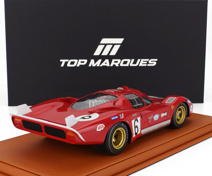 Modèle réduit de voiture de course Red Top Marques avec numéro 6, jantes dorées, sur socle en cuir, disponible sur Vroomi