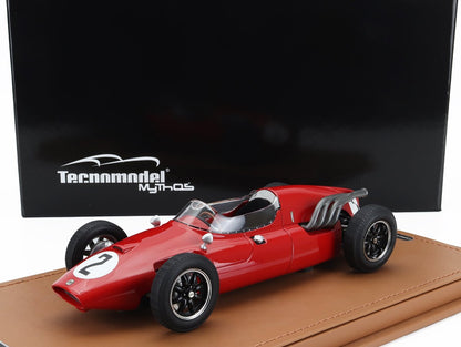 Modèle réduit vintage rouge de la voiture de course Tecnomodel portant le numéro 2, présenté sur un socle en cuir, disponible sur Vroomi.