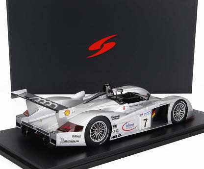 Modèle réduit de voiture de course Audi Sport Team Joest argentée avec aileron arrière et logos des sponsors disponible sur Vroomi