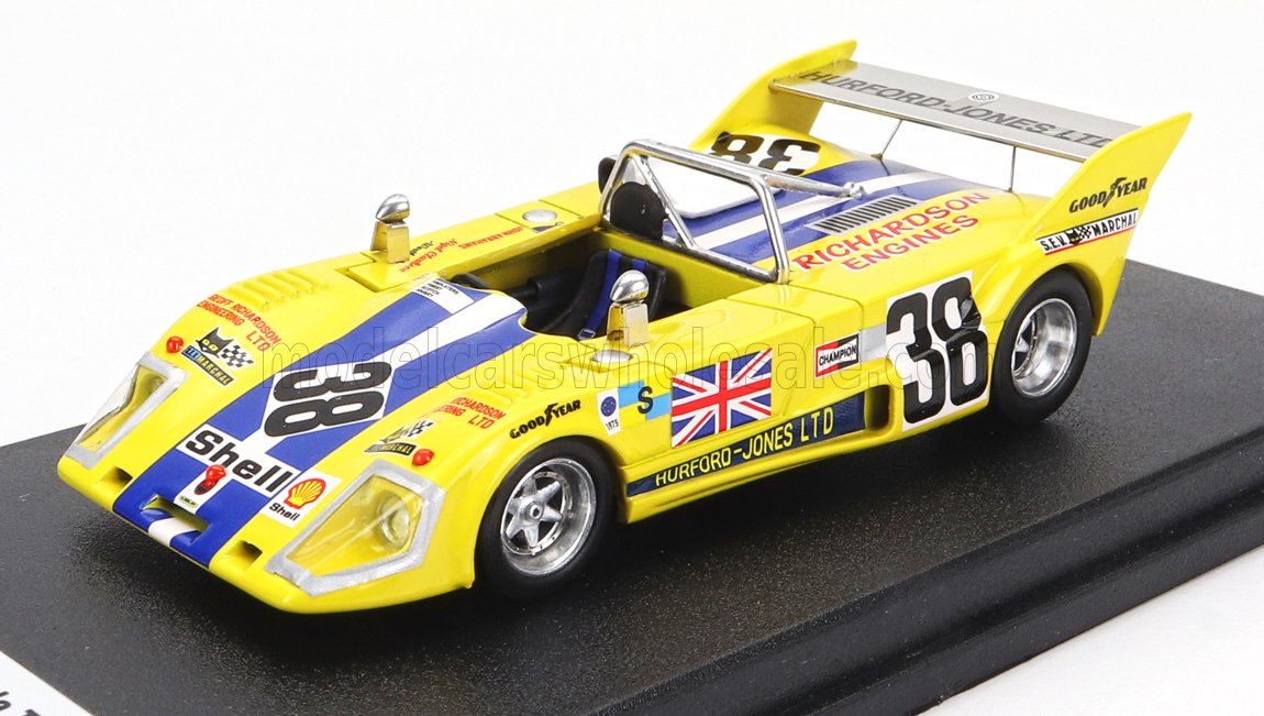 Yellow 1/43 scale model race car with number 38, classic decals, and UK flag, available to order online.