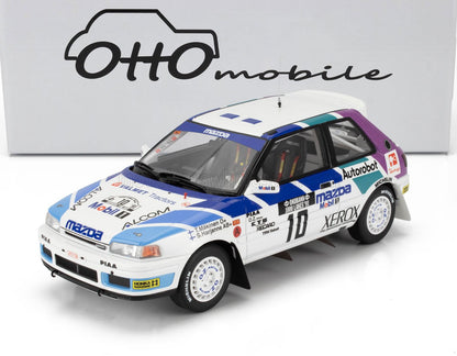MAZDA - 323 GTX N 10 RALLY 1000 LAKES 1991 TOMMY MAKINEN - SEPPO HARJANNE - BLANC BLEU VIOLET