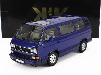 Modèle de fourgon Volkswagen bleu de 1992 avec toit ouvrant et intérieur détaillé, disponible chez Vroomi.