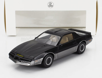 Modèle réduit noir et argent ressemblant à une voiture de sport des années 1980, présenté sur une surface blanche avec un fond blanc, proposé sur Vroomi.