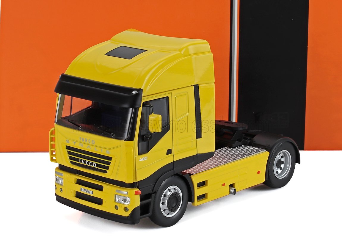Yellow Iveco Stralis 480 truck cab model with black trim, shown on white surface with orange-black background, listed on Vroomi