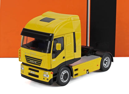 Yellow Iveco Stralis 480 truck cab model with black trim, shown on white surface with orange-black background, listed on Vroomi