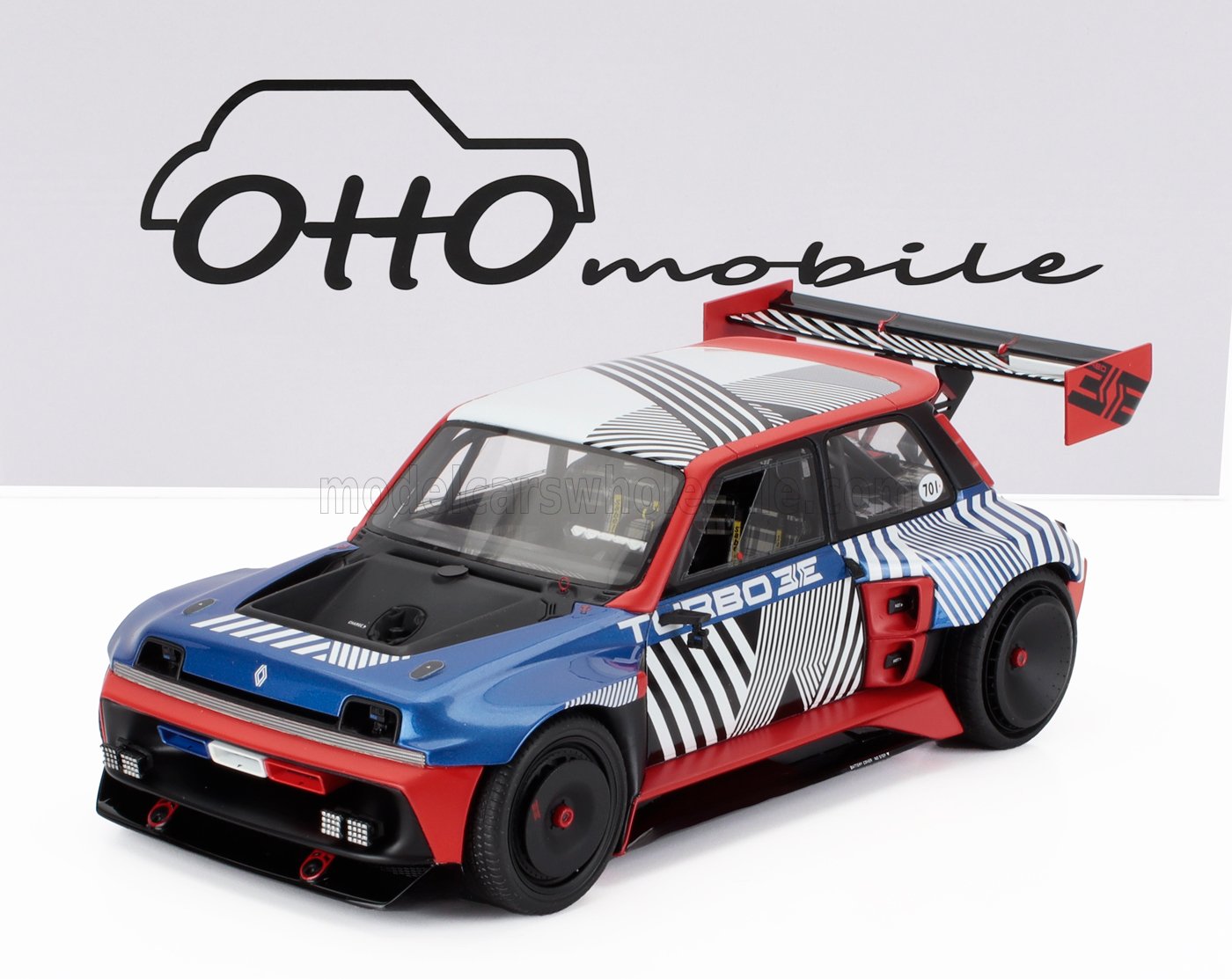 Modèle réduit de voiture de course Renault Turbo 3E bleu, rouge et noir avec décalcomanies géométriques, proposé sur Vroomi.