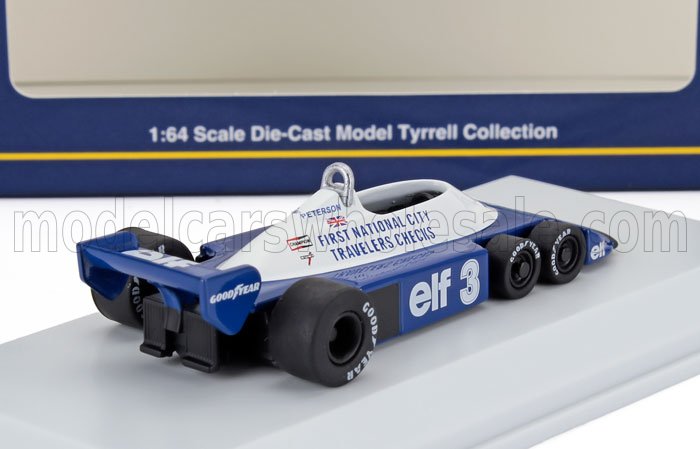 Modèle réduit de voiture de course Tyrrell à l'échelle 1:64, bleu et blanc, avec pneus Goodyear, disponible sur Vroomi.