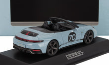 Light blue Porsche 911 Targa 4S model car with black interior, number 70 decal, shown on display stand, now offered on Vroomi