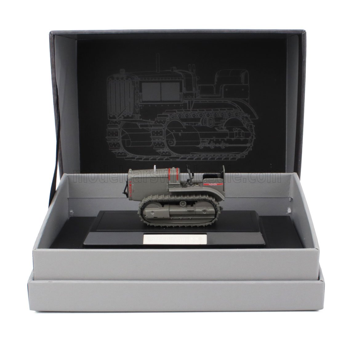 Modèle réduit miniature gris du tracteur Caterpillar présenté dans un coffret de présentation, également proposé sur la plateforme Vroomi.