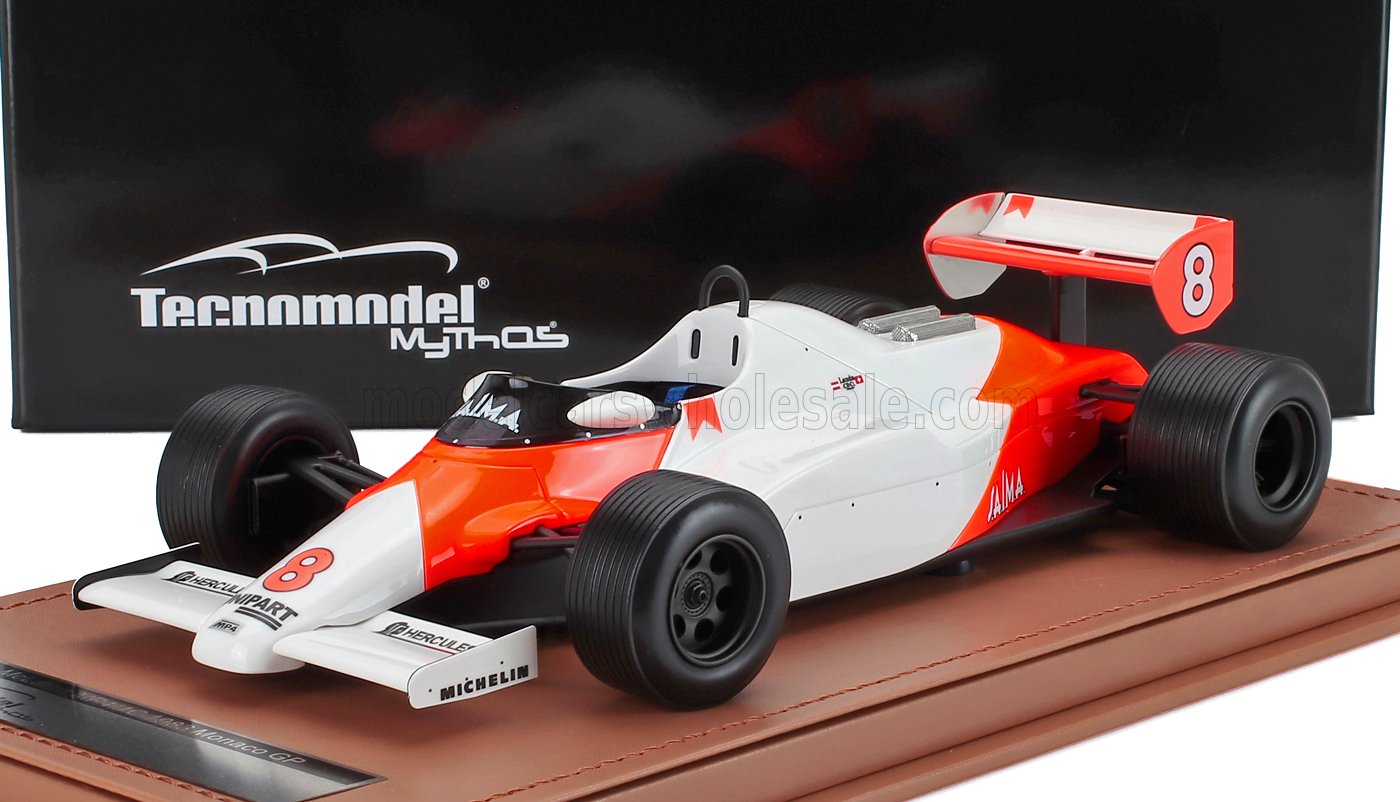 Detailed model of classic Formula 1 car in white and orange, displayed on a stand, available on Vroomi