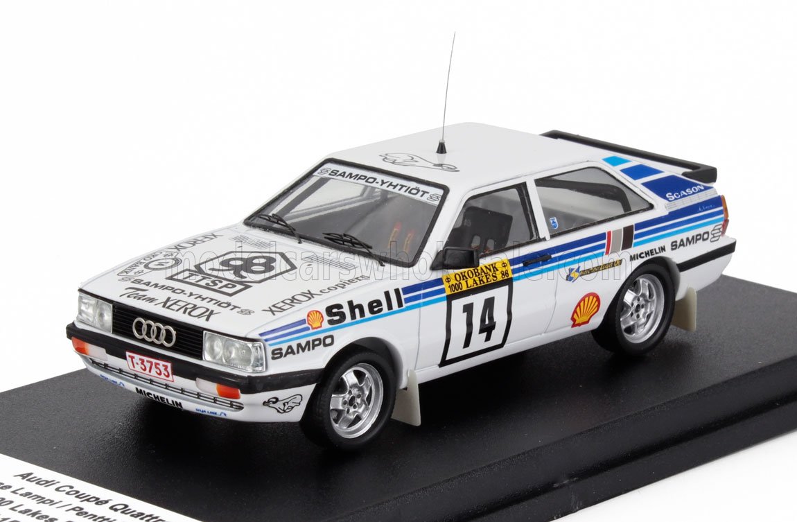 Modèle réduit de voiture de rallye Audi Coupé Quattro blanche avec le numéro 14, les logos Shell et Sampo, référencé sur Vroomi.