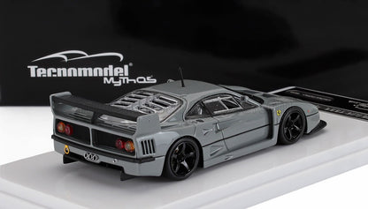 Modèle réduit de voiture de course Ferrari F40 grise par Tecnomodel avec des roues noires, un aileron arrière et un capot moteur en treillis métallique, disponible sur Vroomi.