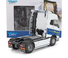Detailed scale model of white and blue Volvo truck tractor unit with Truck Edition box, available on Vroomi