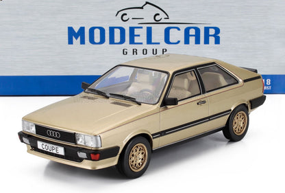 Modèle réduit de voiture Audi coupé doré à l'échelle 1/18 avec intérieur détaillé, présenté avec la marque Model Car Group, disponible chez Vroomi.