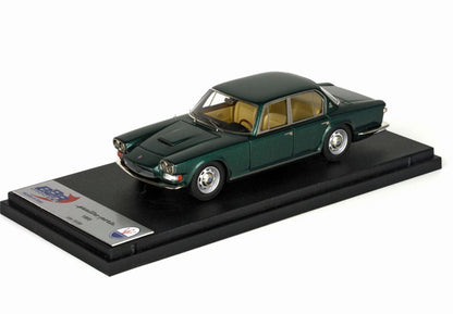 Green 1965 Maserati Quattroporte scale model with beige interior displayed on black stand, offered on Vroomi