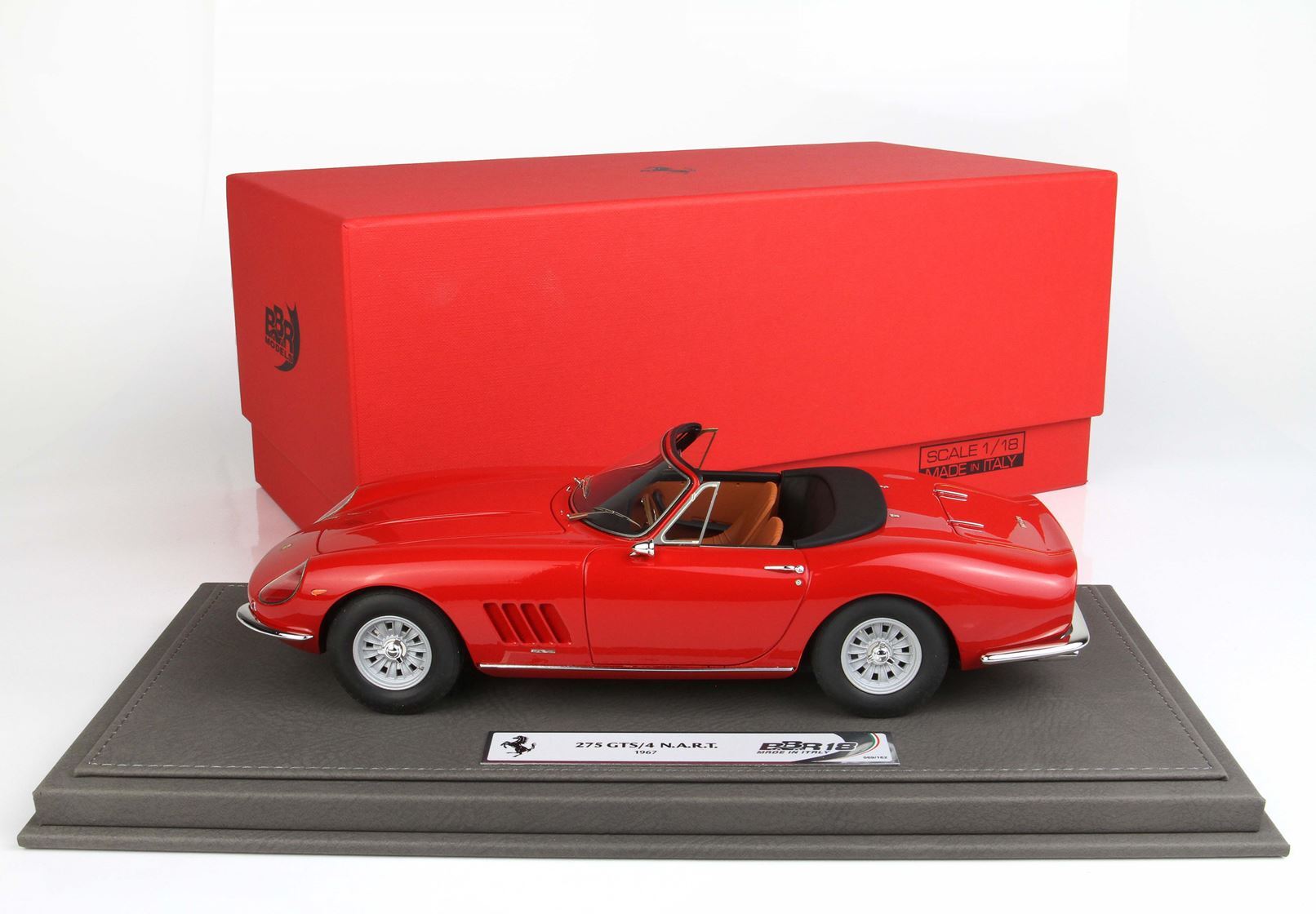 Red 1:18 scale Ferrari 275 GTS/4 N.A.R.T. model on display base with red box, available on Vroomi