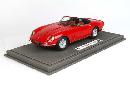 Red Ferrari 275 GTB/4 model car on grey display stand, available for purchase via Vroomi