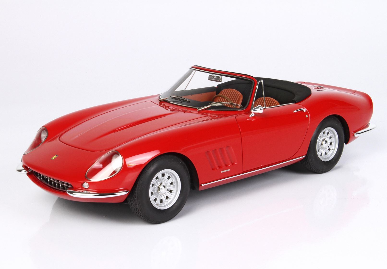 Red vintage convertible sports car model with tan interior, chrome details, showcased with Vroomi access