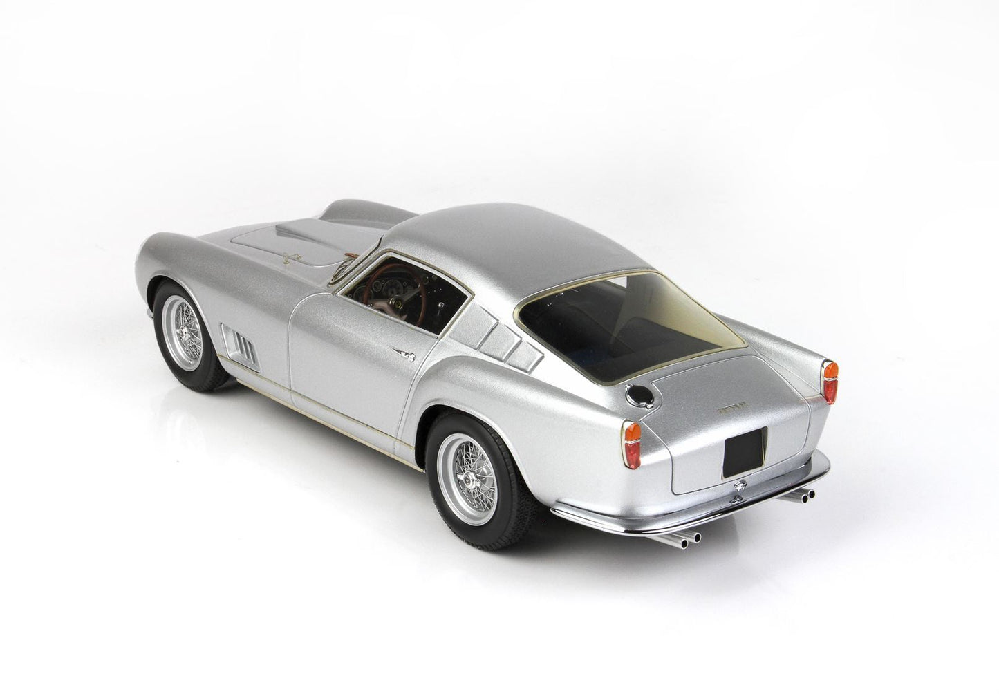 Silver vintage sports car model with wire wheels, detailed interior, available on Vroomi platform
