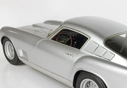 Silver vintage sports car model with wire spoke wheels and detailed interior, available through Vroomi