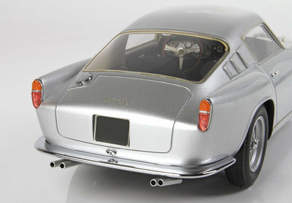 Silver classic Ferrari model car rear view with orange tail lights and dual exhaust, offered on Vroomi
