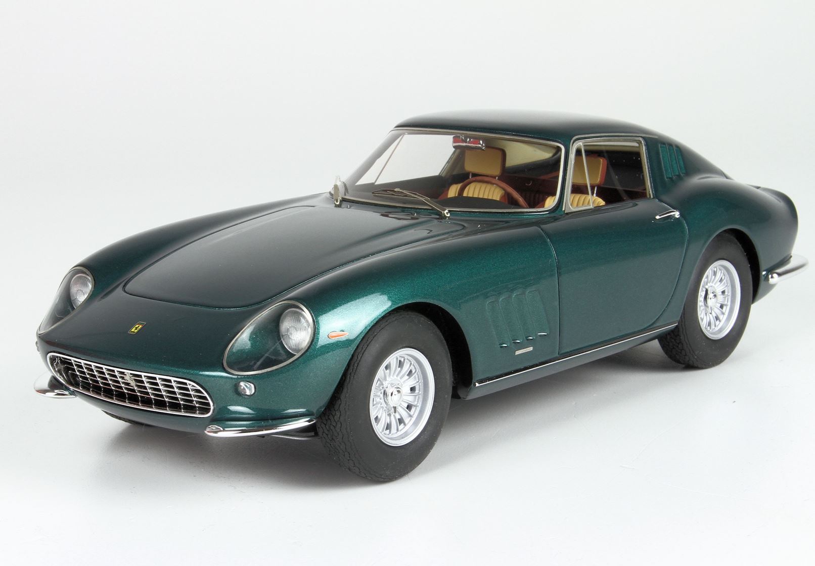 Dark green classic Ferrari sports car model with beige interior, available on Vroomi platform