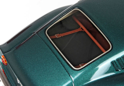 Green vintage car rear window with brown leather strap detail, model available on Vroomi platform