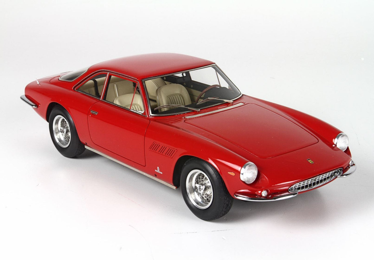 Red classic Ferrari sports car model with beige interior, detailed chrome wheels, available on Vroomi