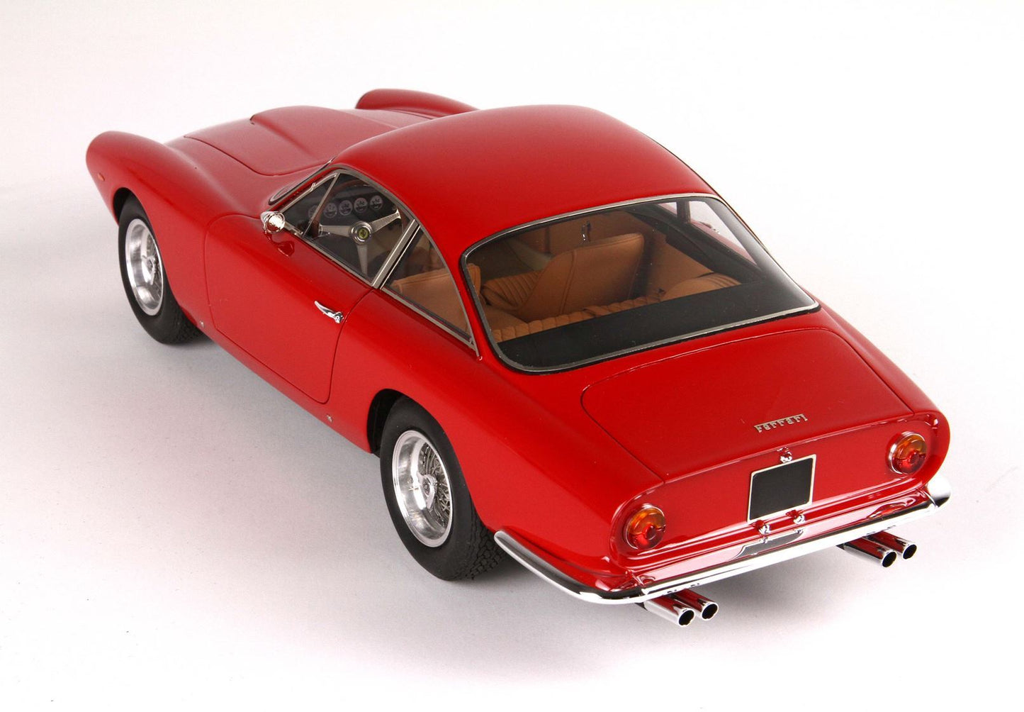 Red classic Ferrari coupe with tan interior, chrome exhausts, and sporty design, now offered on Vroomi