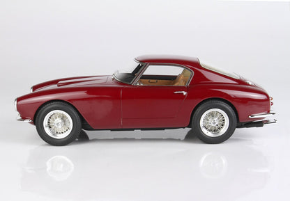 Vue latérale d'une voiture de sport vintage classique de couleur marron foncé avec intérieur beige, disponible sur la plateforme Vroomi.