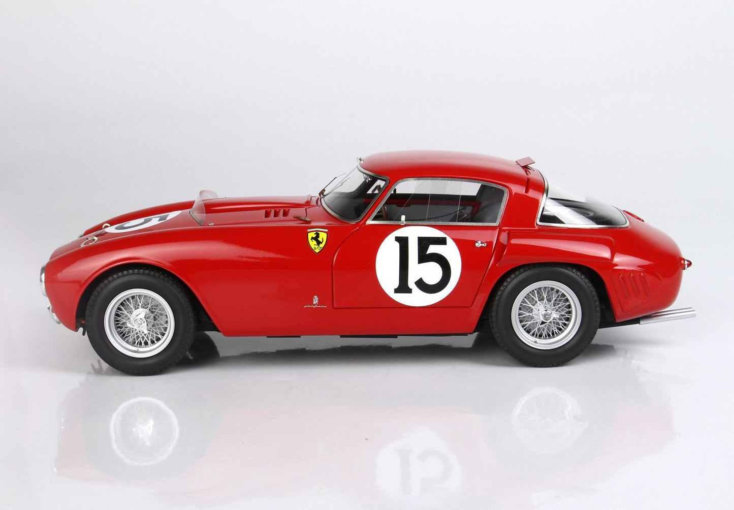 Red vintage Ferrari race car with number 15, classic wire wheels, available on Vroomi platform