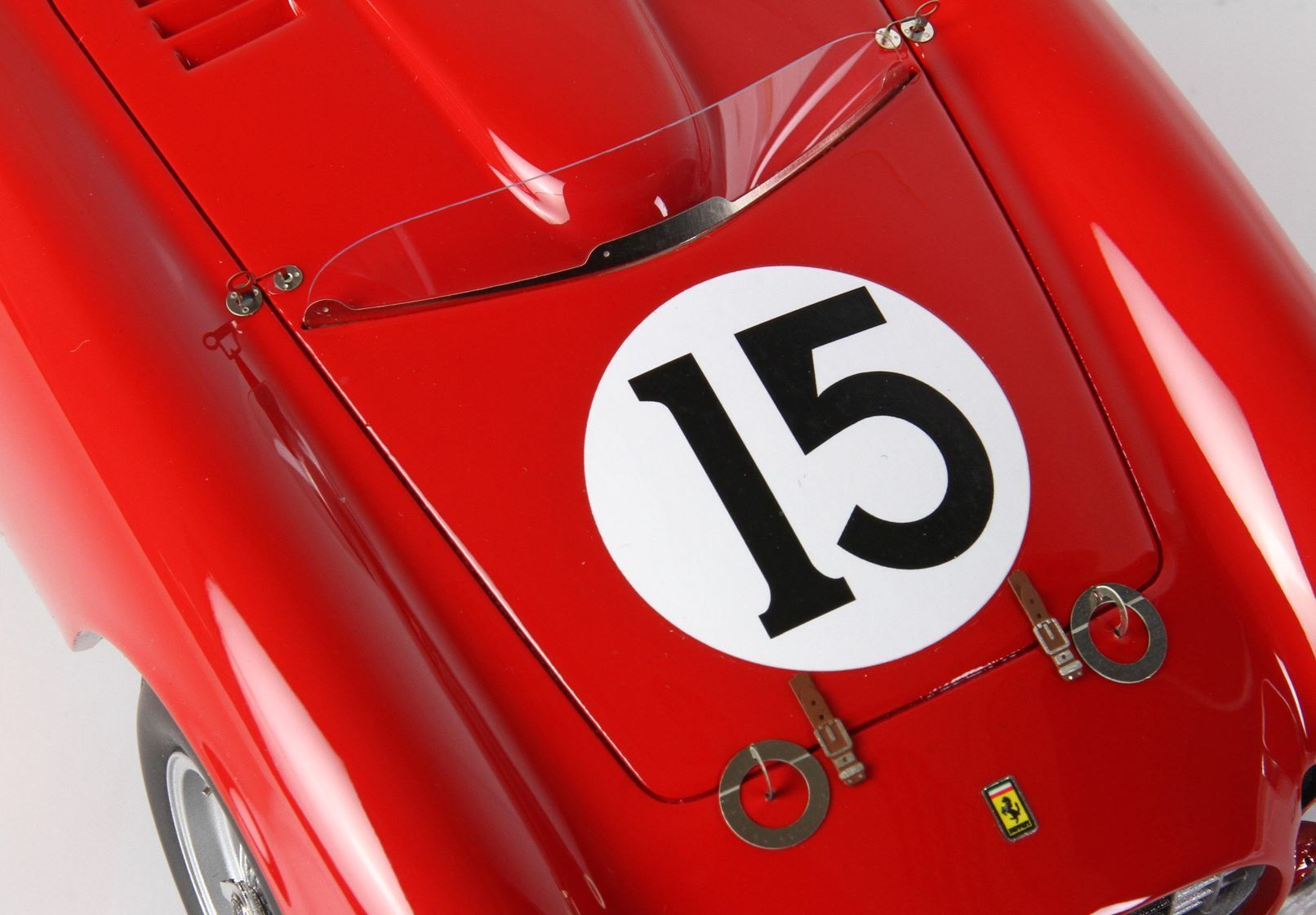 Red vintage race car with number 15 on hood, classic design, and available on Vroomi platform