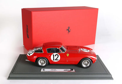 Red Ferrari 340 MM model car with number 12 on gray display base, classic red box, available through Vroomi