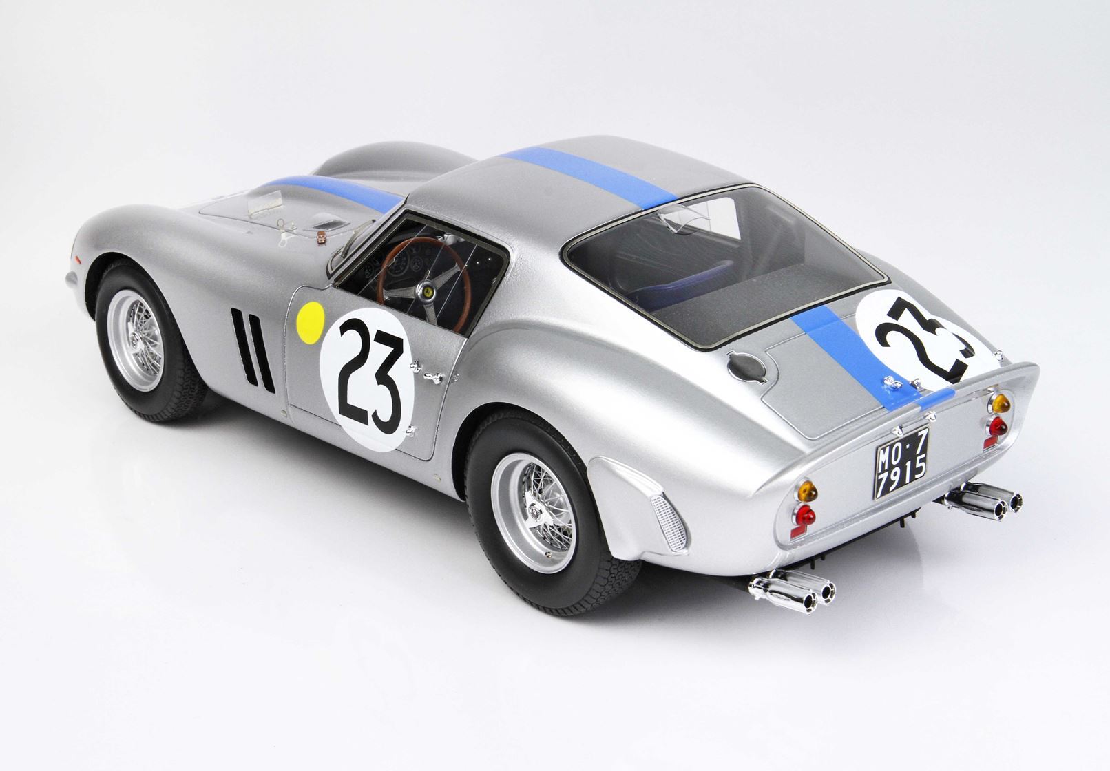 Silver vintage race car with number 23 and blue stripe, available for purchase on Vroomi