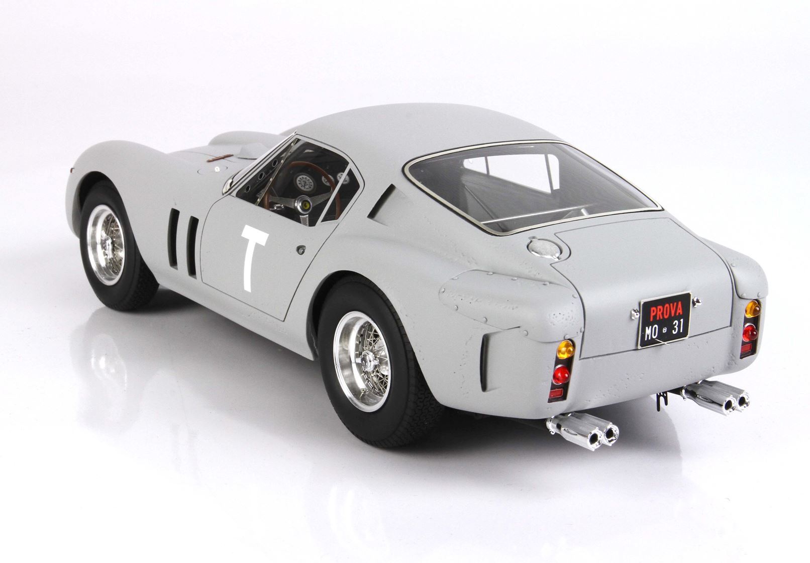 Vintage grey race car model with T decal and PROVA license plate, available on Vroomi