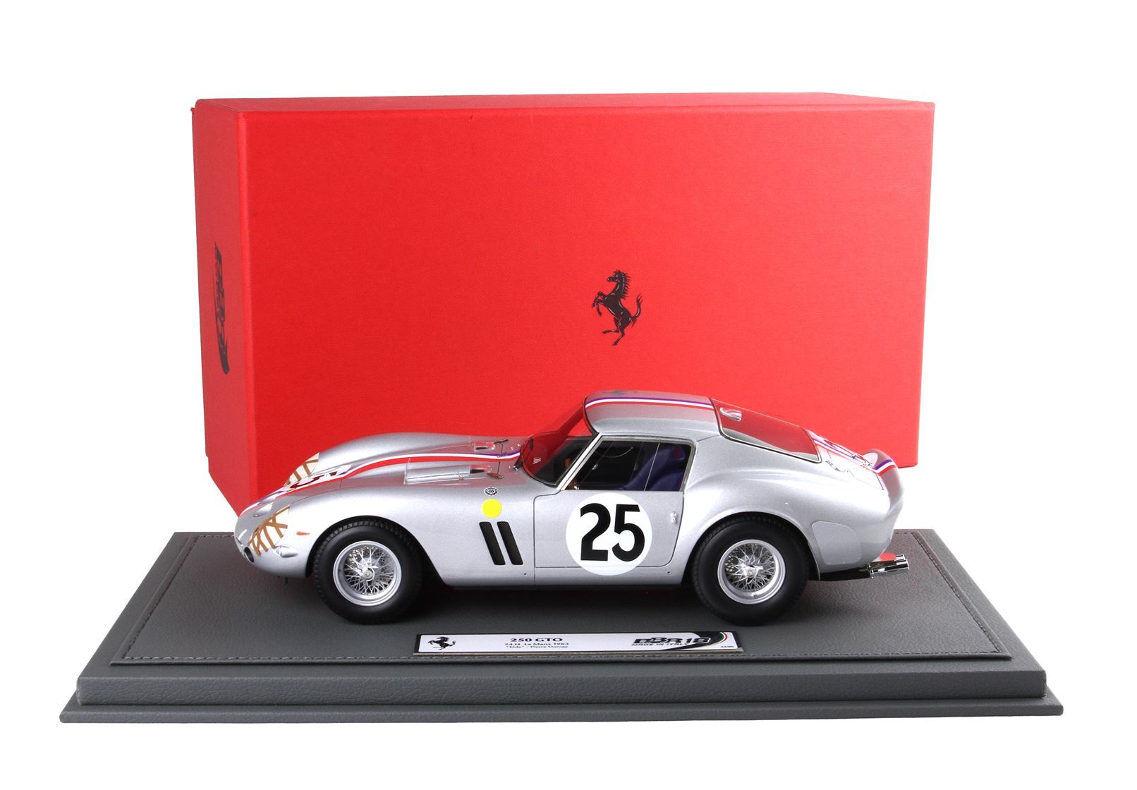 Silver Ferrari 250 GTO model car with number 25 on side, displayed on gray base, red Ferrari box behind, available on Vroomi