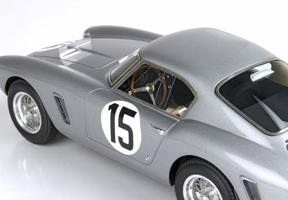 Silver vintage race car with number 15, classic wire wheels, and wooden steering, available via Vroomi