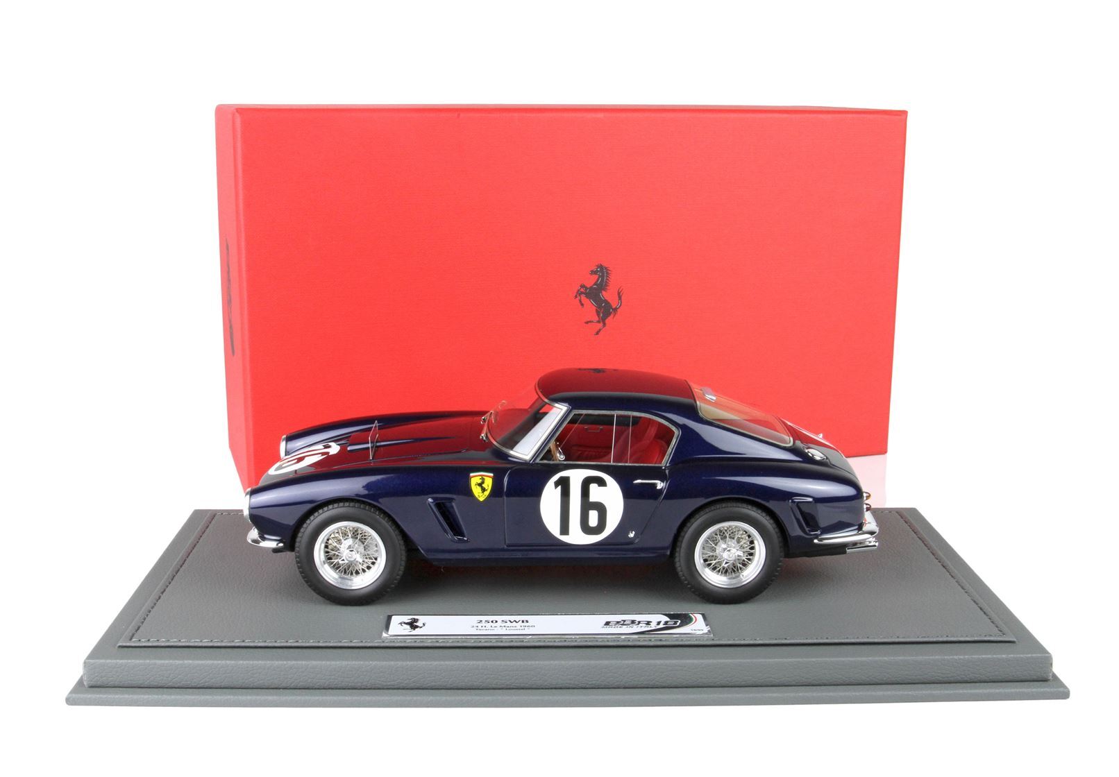 Blue Ferrari 250 SWB model car with number 16 on stand, in front of red Ferrari box, available on Vroomi