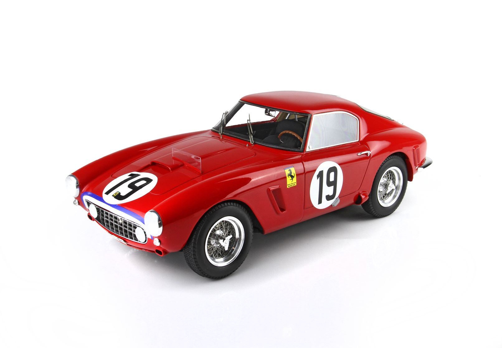 Red vintage Ferrari race car model 19 with chrome wire wheels, available through Vroomi