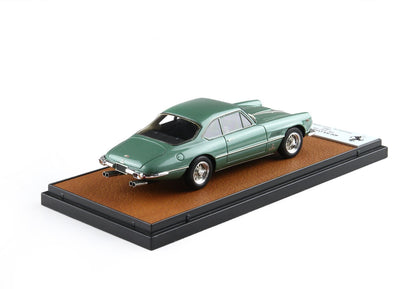 Green vintage Ferrari model car on brown leather base with black frame, offered through Vroomi